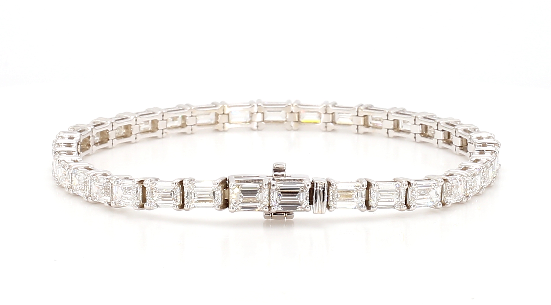 Explore luxury with our "10 CTW Emerald Lab Crown Diamond Tennis Bracelet" available in White, Yellow, Rose 14K Gold, and Platinum.